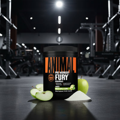 Container of Animal Pre Workout Fury with apples and powder on a gym floor.