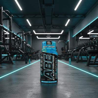 ABE All Black Everything pre-workout supplement bottle blue lagoon on a gym background