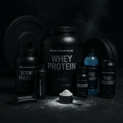 Fitness supplement stack bundle featuring vegan protein, whey protein, pre-workout, creatine and protein bars on a dark gym background
