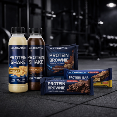 Protein snacks on the go including ready-to-drink protein shakes, protein brownies and protein bars displayed in a gym setting with NULTRAFITUK products