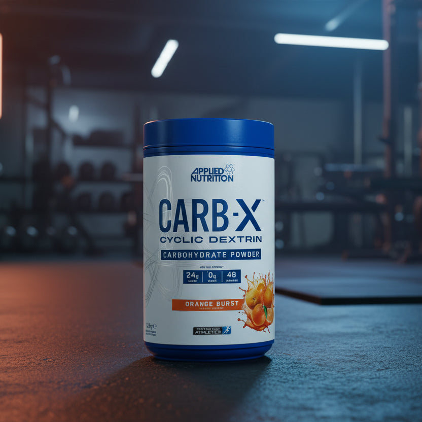 Applied Nutrition Carb-X Cyclic Dextrin powder container on a gym floor