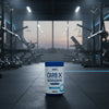 Applied Nutrition Carb-X Cyclic Dextrin powder container on a gym floor