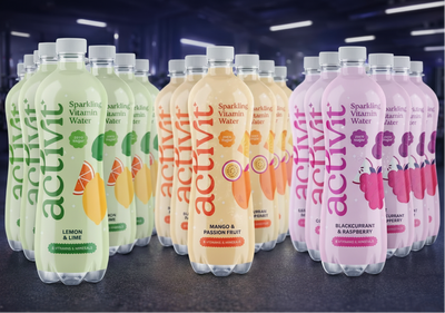 Assorted bottles of Activit sparkling vitamin water on a gym background