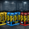 Assorted boxes of TNT Nuclear products in a gym setting