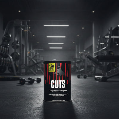 Dietary supplement container labeled 'CUTS' with red and black design on a gym background