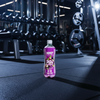 NXT protein supplement bottle in a gym setting