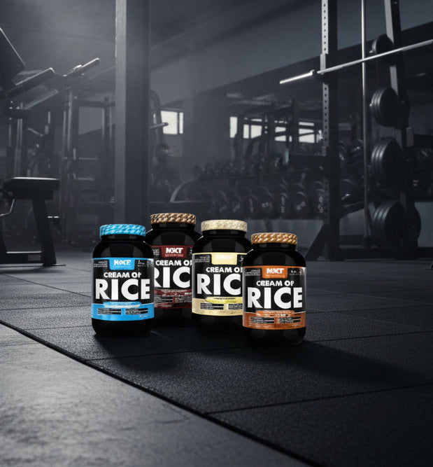 Four bottles of Cream of Rice on a gym floor with gym equipment in the background