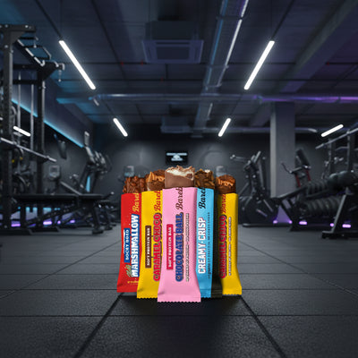 Assorted candy bars in front of a gym