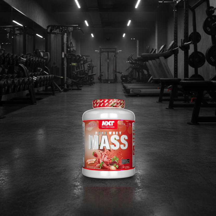 Supplement container labeled 'MASS' in a gym setting