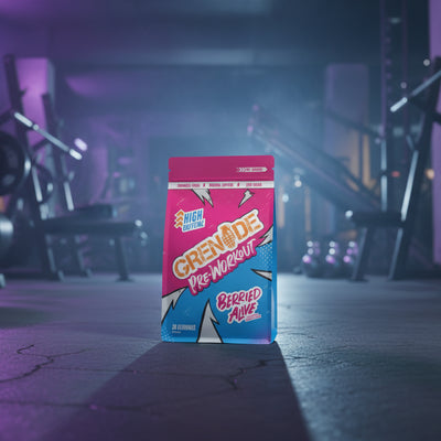 Grenade pre-workout powder package in a gym setting